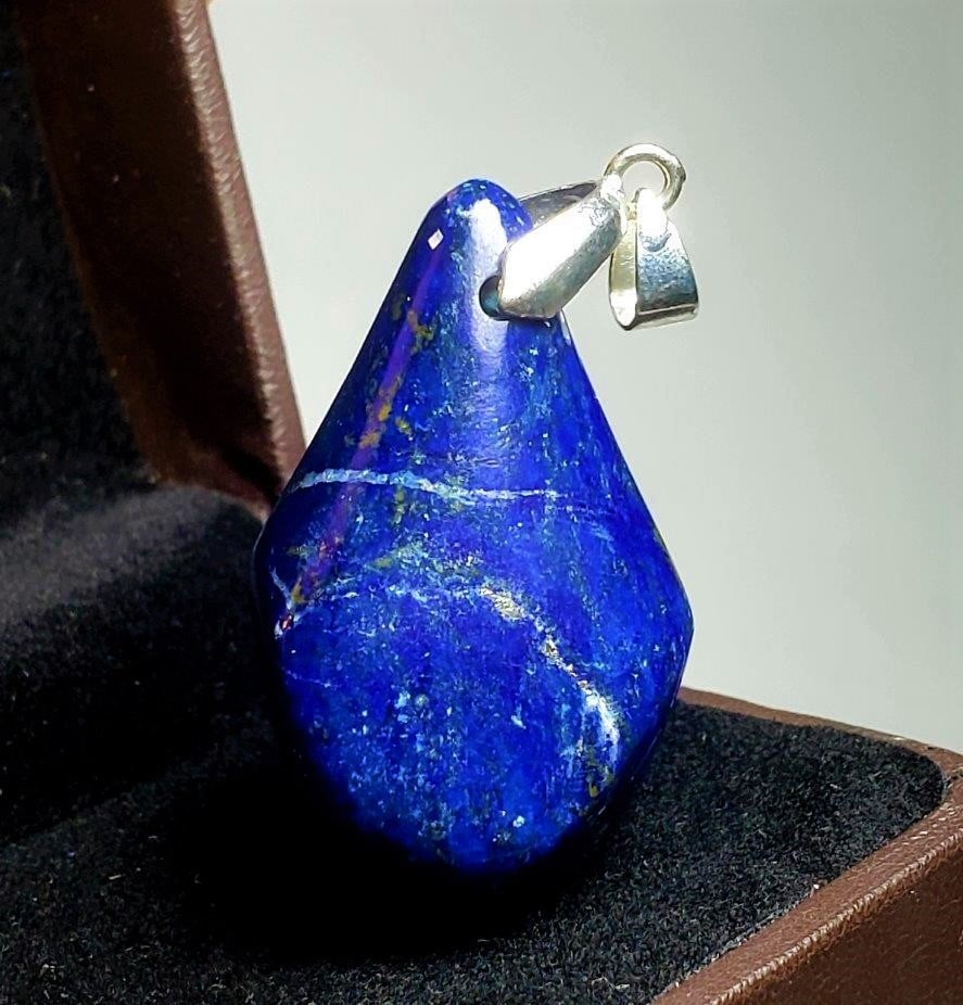 Polished Lapis Pendant: Polished Lapis Pendant - 38X28X23 mm Shipping: $23.00. Shipping rates are determined by Parcel weight and destination.