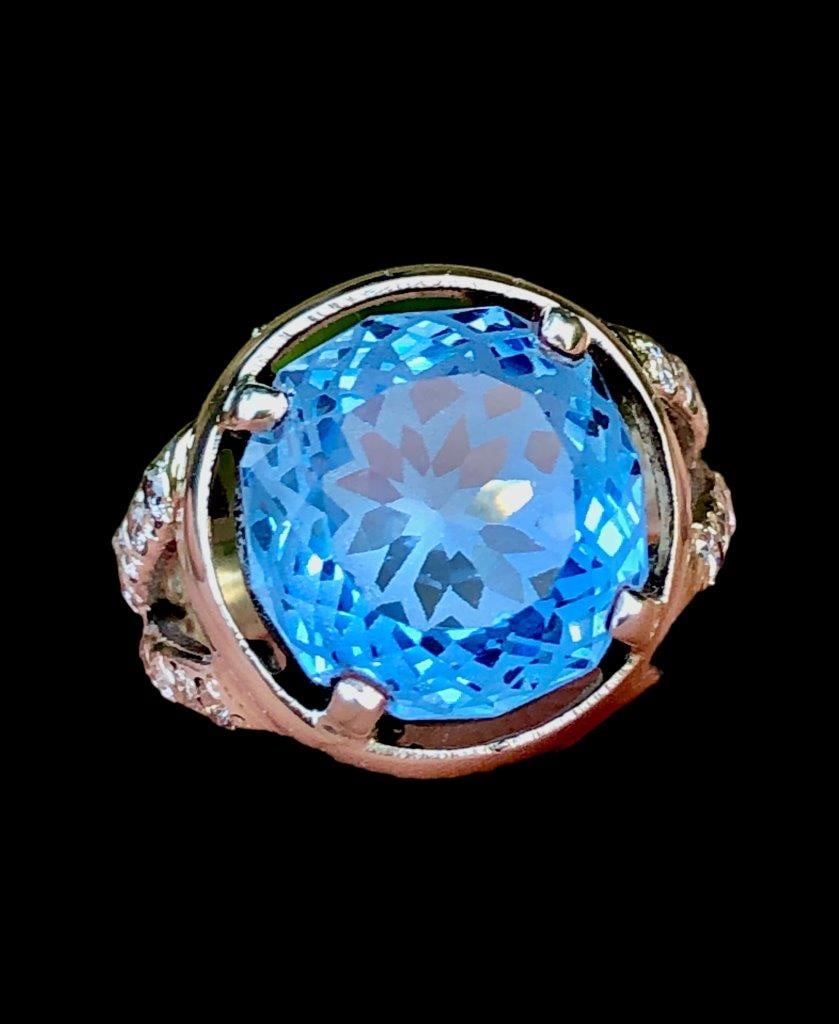 Flower Swiss Blue Topaz Ring in Silver: Flower Swiss Blue Topaz Ring in SilverStone Weight: 10.45 CaratsRing Size: 7 US (Adjustable)Ring Weight: 7.23 Grams Choose design of your own and we will make it for youWe accept custom order in Sterl