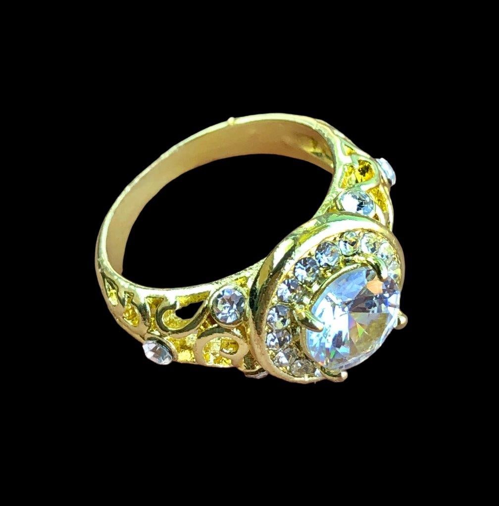 Gold Plated Copper Ring With White Zircons: Gold Plated Copper Ring With White Zircons FREE SHIPPING Shipping rates are determined by Parcel weight and destination.