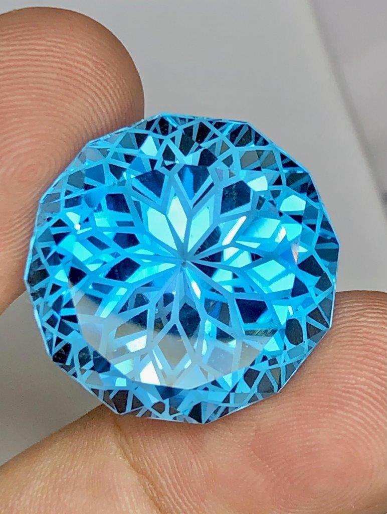 47.65 Carats Perfect Flower Cut Swiss Blue Topaz - 22X22X15 mm: 47.65 Carats Perfect Flower Cut Swiss Blue Topaz - 22X22X15 mmShipping Rate: $15.00 .shipping rates are determined by Parcel weight and destination.Combined shipping: We offer combine shipping on mult