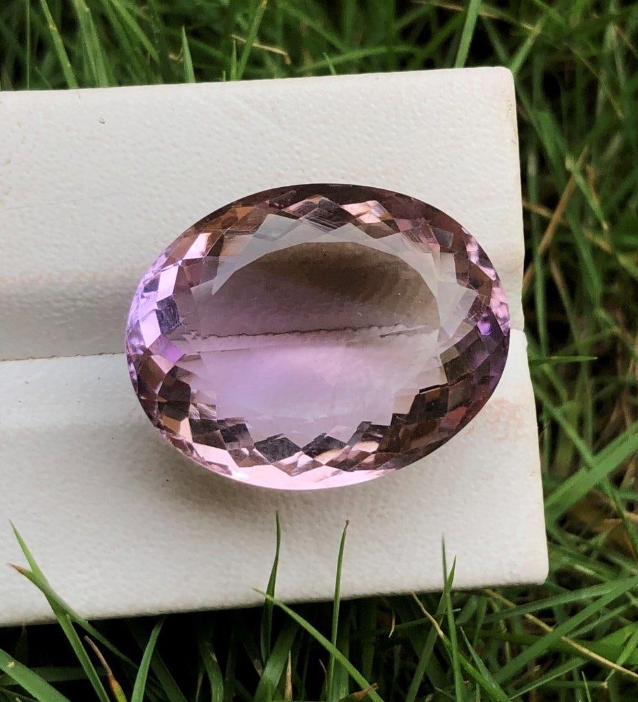 25.70 Carats Oval Shape Natural Ametrine: 25.70 Carats Oval Shape Natural Ametrine - 20X17X12 mmShipping Rate: $15.00 .shipping rates are determined by Parcel weight and destination.Combined shipping: We offer combine shipping on multiple ite