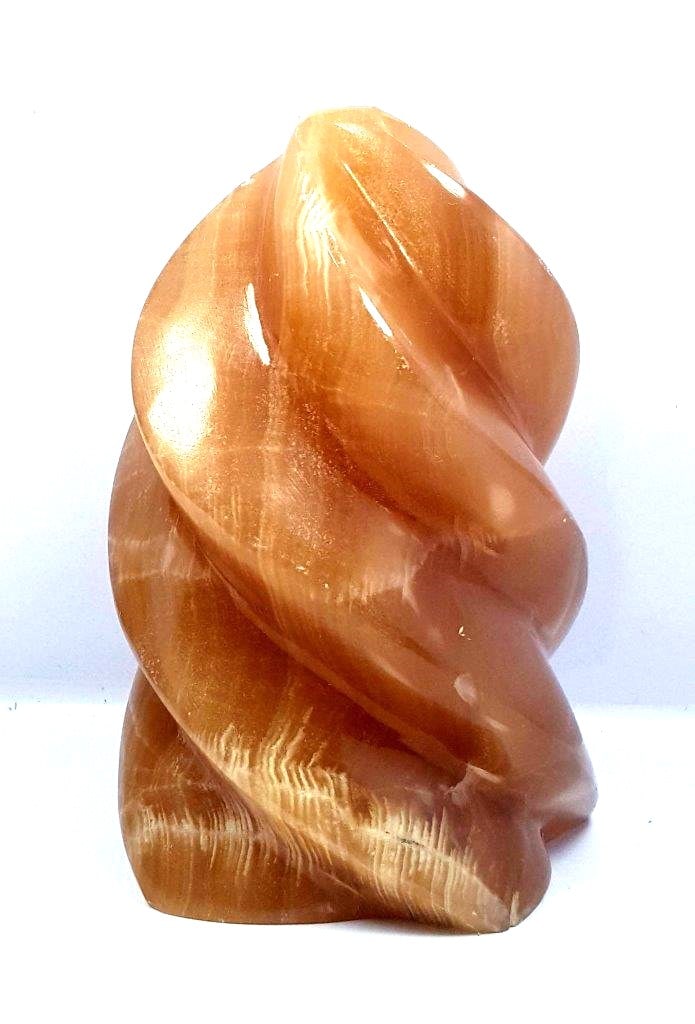 Polished Honey Calcite Flame - 665.6 Grams: Polished Honey Calcite Flame - 665.6 Grams - 110X71X64 mmShipping Rate: $55.00 .shipping rates are determined by Parcel weight and destination.Combined shipping: We offer combine shipping on multiple