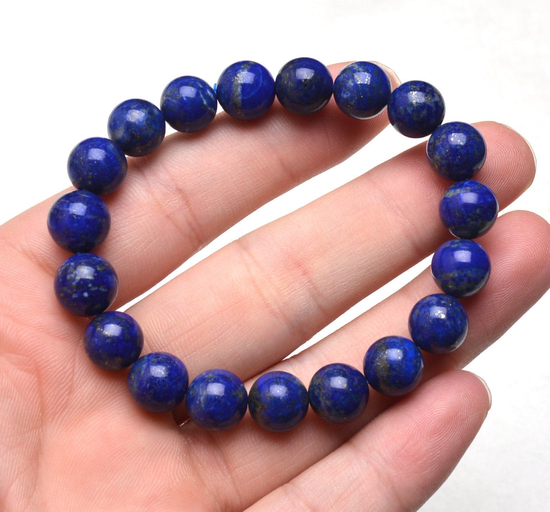 Royal Blue Lapis Lazuli Gemstone Beads Bracelet: Natural Royal Blue Lapis Lazuli Gemstone Carved Beads BraceletShipping Rate: $23.00 .shipping rates are determined by Parcel weight and destination.Combined shipping: We offer combine shipping on