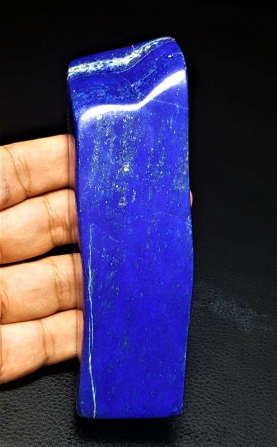 Lapis Lazuli Polished Tumble - 343 grams: Lapis Lazuli Polished Tumble - 343 grams 125X37X29 mmShipping Rate: $45.00 .shipping rates are determined by Parcel weight and destination.Combined shipping: We offer combine shipping on multiple item