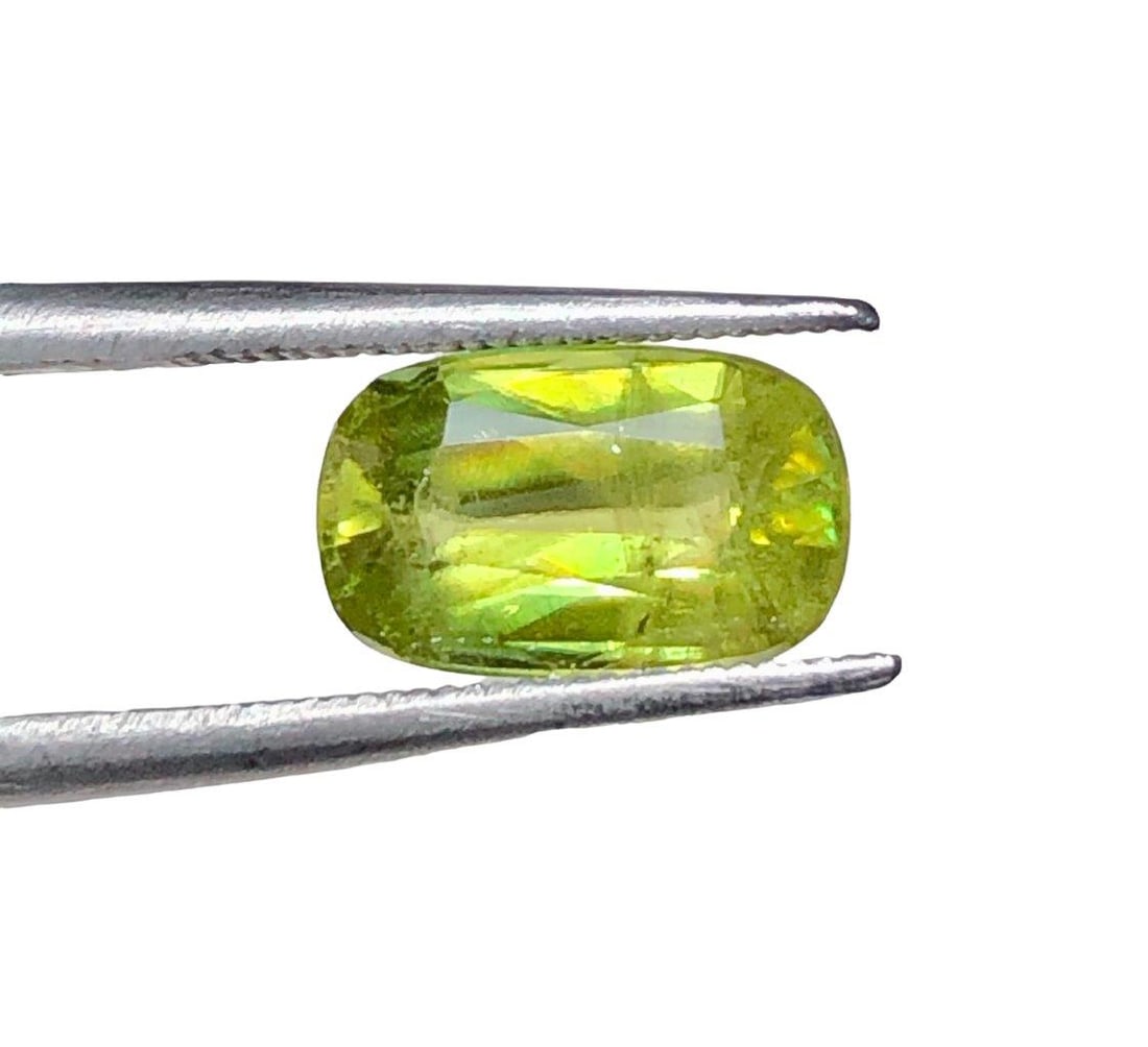 Fire Chrome Sphene Loose Gemstone - 2.25 Carats - 10X7X4 mm: Fire Chrome Sphene Loose Gemstone - 2.25 Carats - 10X7X4 mmShipping Rate: $15.00 .shipping rates are determined by Parcel weight and destination.Combined shipping: We offer combine shipping on multipl