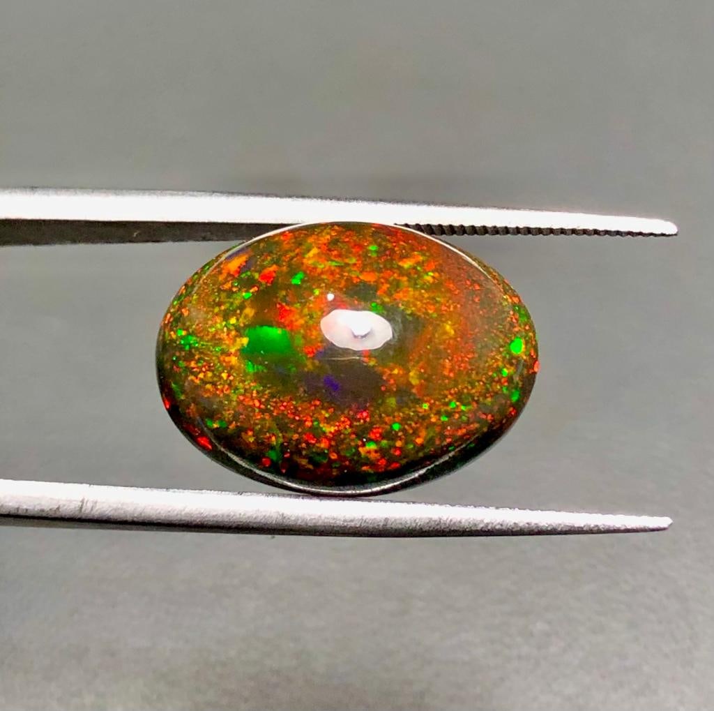 7.7 Carats AAA Quality Natural Fiery Black Opal - 17X13X8 mm: 7.7 Carats AAA Quality Natural Fiery Black Opal - 17X13X8 mm Shipping Rate: FREE SHIPPINGshipping rates are FREE WORLDWIDECombined shipping: We offer combine shipping on multiple items purchased to re