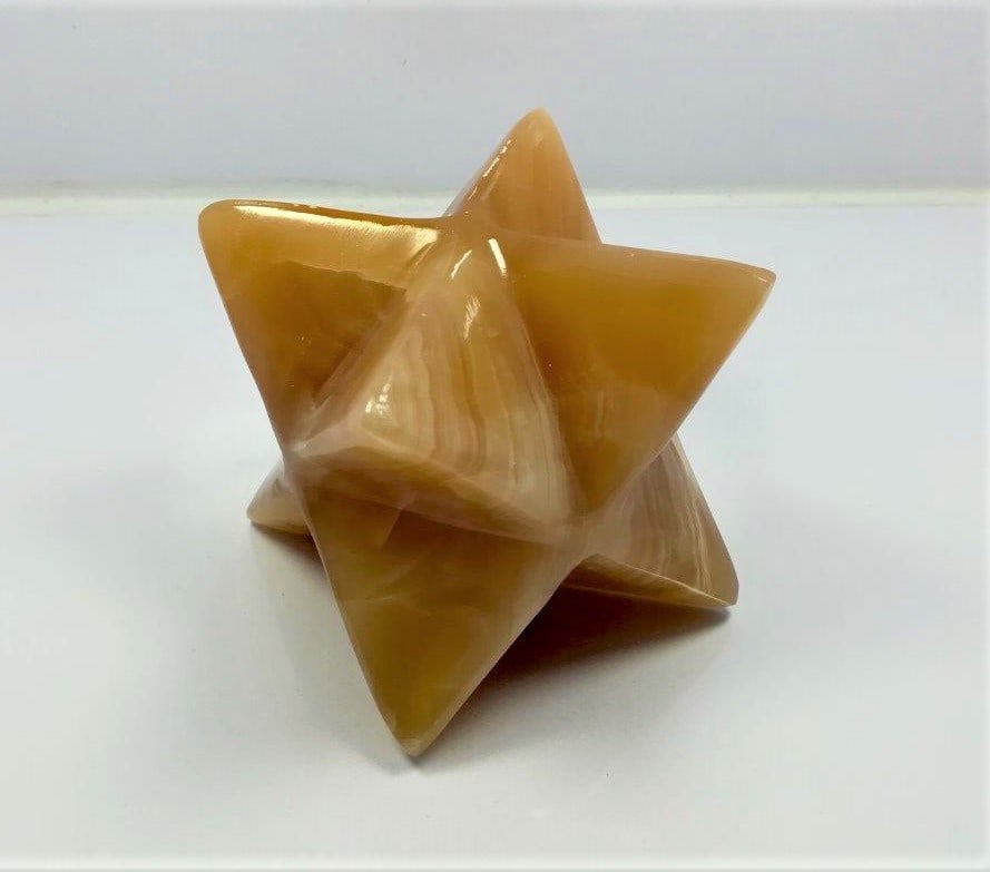 Honey Calcite Star - 320 Grams: Honey Calcite Star - 320 Grams Shipping: $45.00. Shipping rates are determined by Parcel weight and destination.