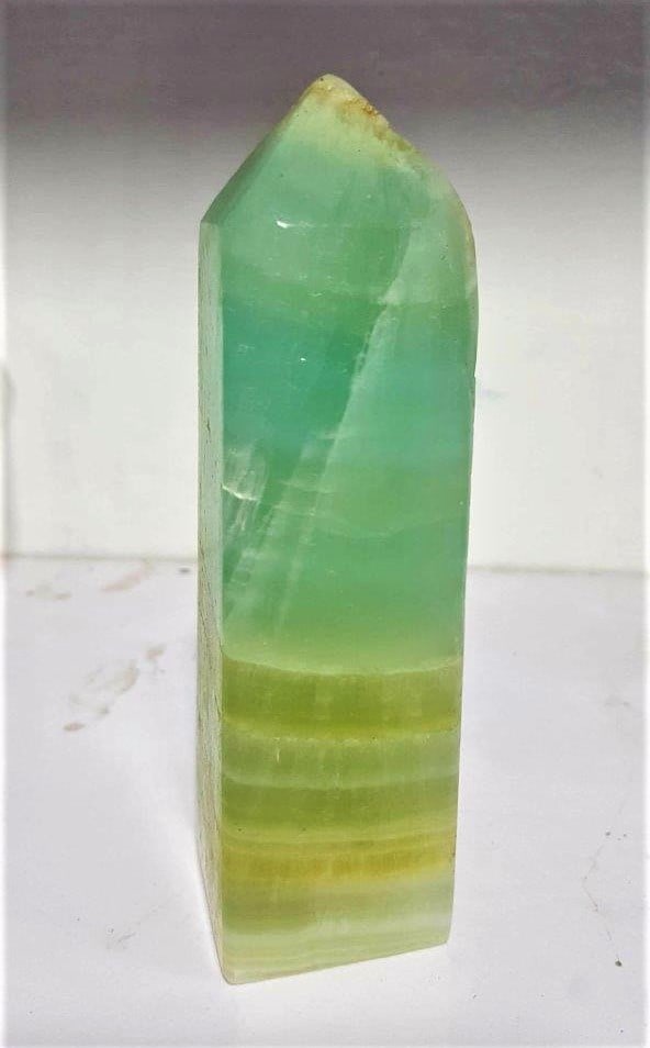 420 Grams Pastichio Calcite Tower: 420 Grams Pastichio Calcite TowerShipping Rate: $45.00 .shipping rates are determined by Parcel weight and destination.Combined shipping: We offer combine shipping on multiple items purchased to