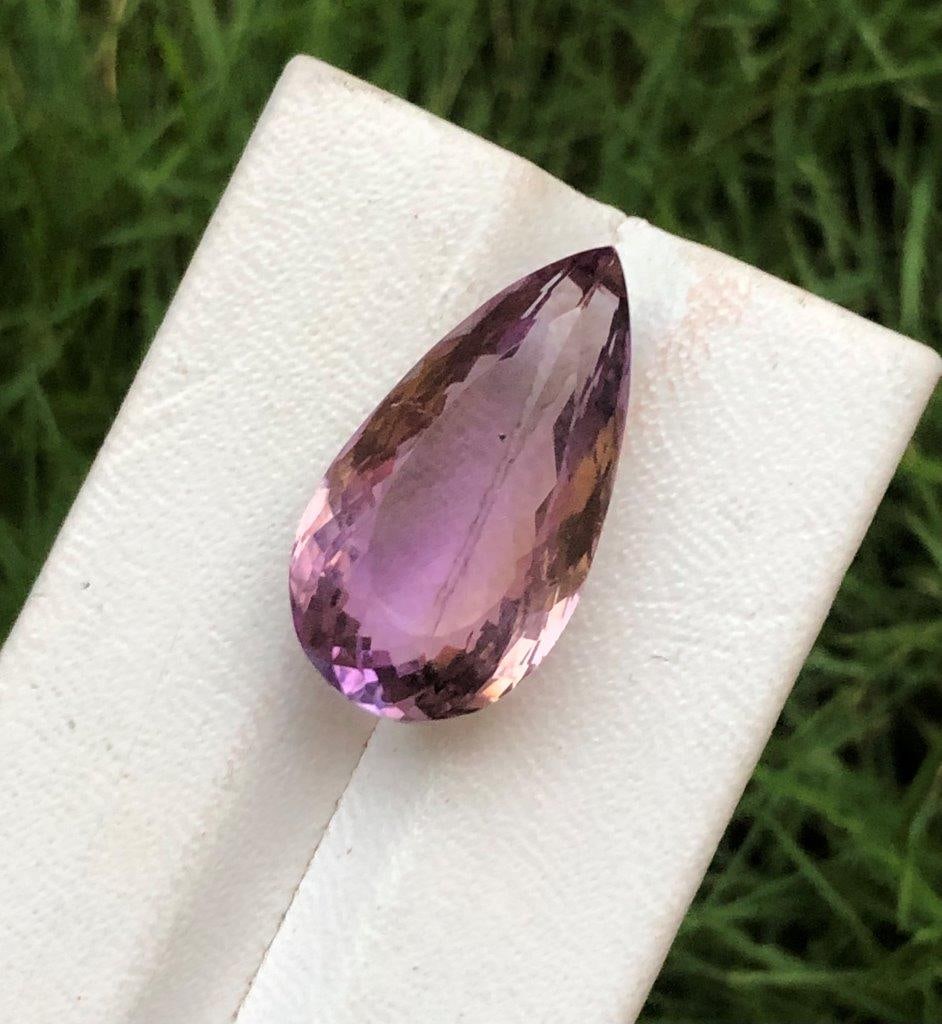 30.15 Carats Natural Ametrine Loop Clean: 30.15 Carats Natural Ametrine Loop Clean - 26X16X13 mmShipping Rate: $15.00 .shipping rates are determined by Parcel weight and destination.Combined shipping: We offer combine shipping on multiple