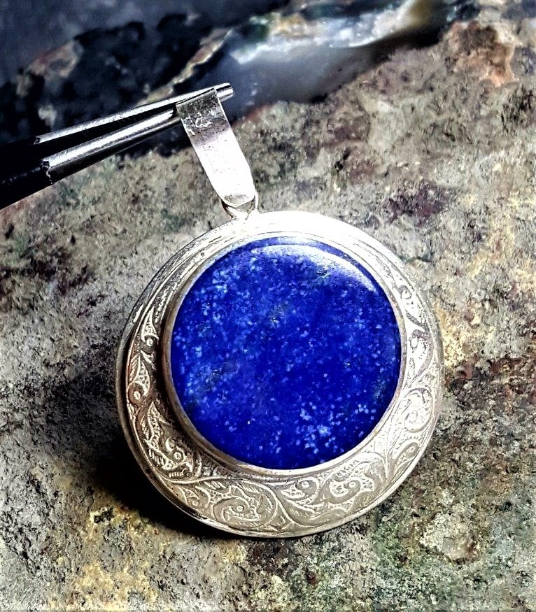 Sterling Silver Lapis Pendant: Sterling Silver Lapis Pendant - 36X33X9 mmShipping Rate: $23.00 .shipping rates are determined by Parcel weight and destination.Combined shipping: We offer combine shipping on multiple items purchased