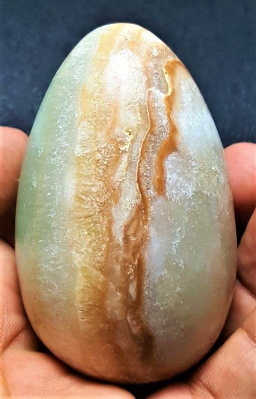 Carrabian Calcite Polished Egg - 196 Grams: Carrabian Calcite Polished Egg - 196 Grams - 71X43 mm Shipping: $23.00. Shipping rates are determined by Parcel weight and destination.