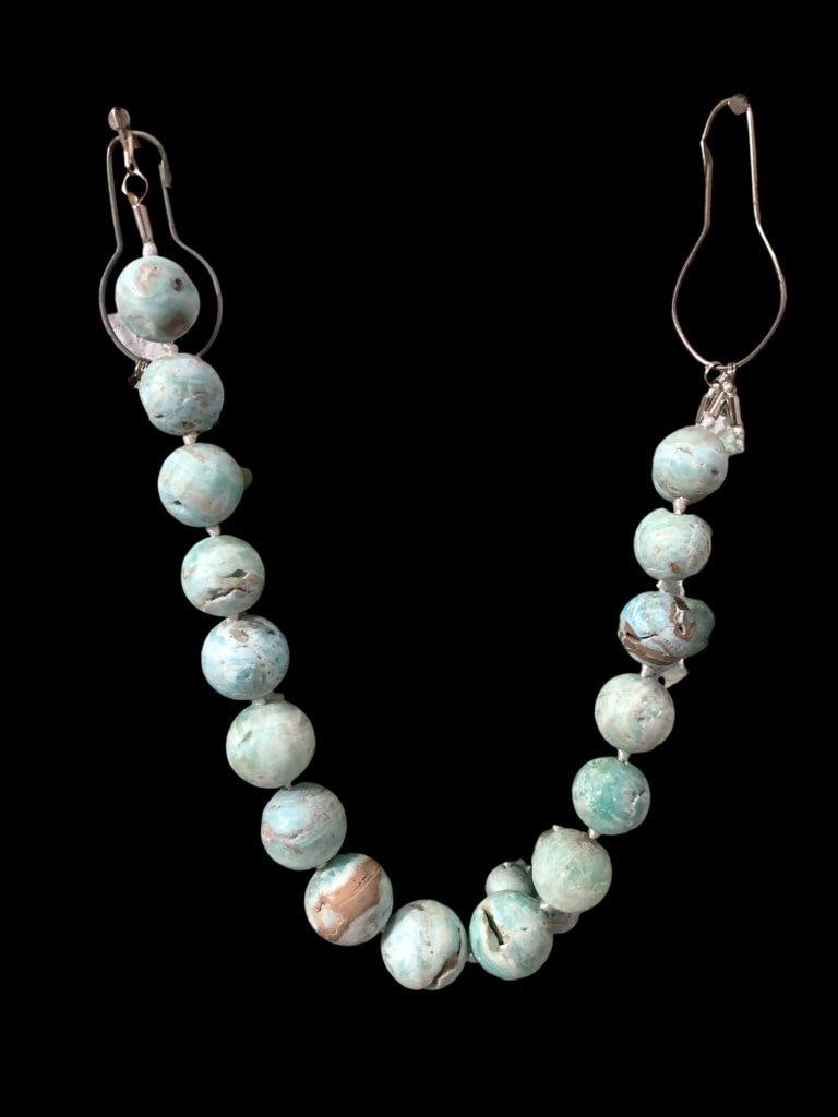 Polished Aragonite Beaded Necklace: Polished Aragonite Beaded Necklace On Matrix - 21X16X16 mm Shipping: $23.00. Shipping rates are determined by Parcel weight and destination.