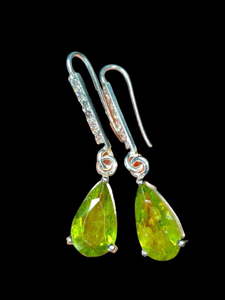 Natural Peridot Earrings In Silver: Natural Peridot Earrings In SilverStones Weight: 12 Carats Jewelry Weight: 6.28 Grams Choose design of your own and we will make it for youWe accept custom order in Sterling Silver, Gold and