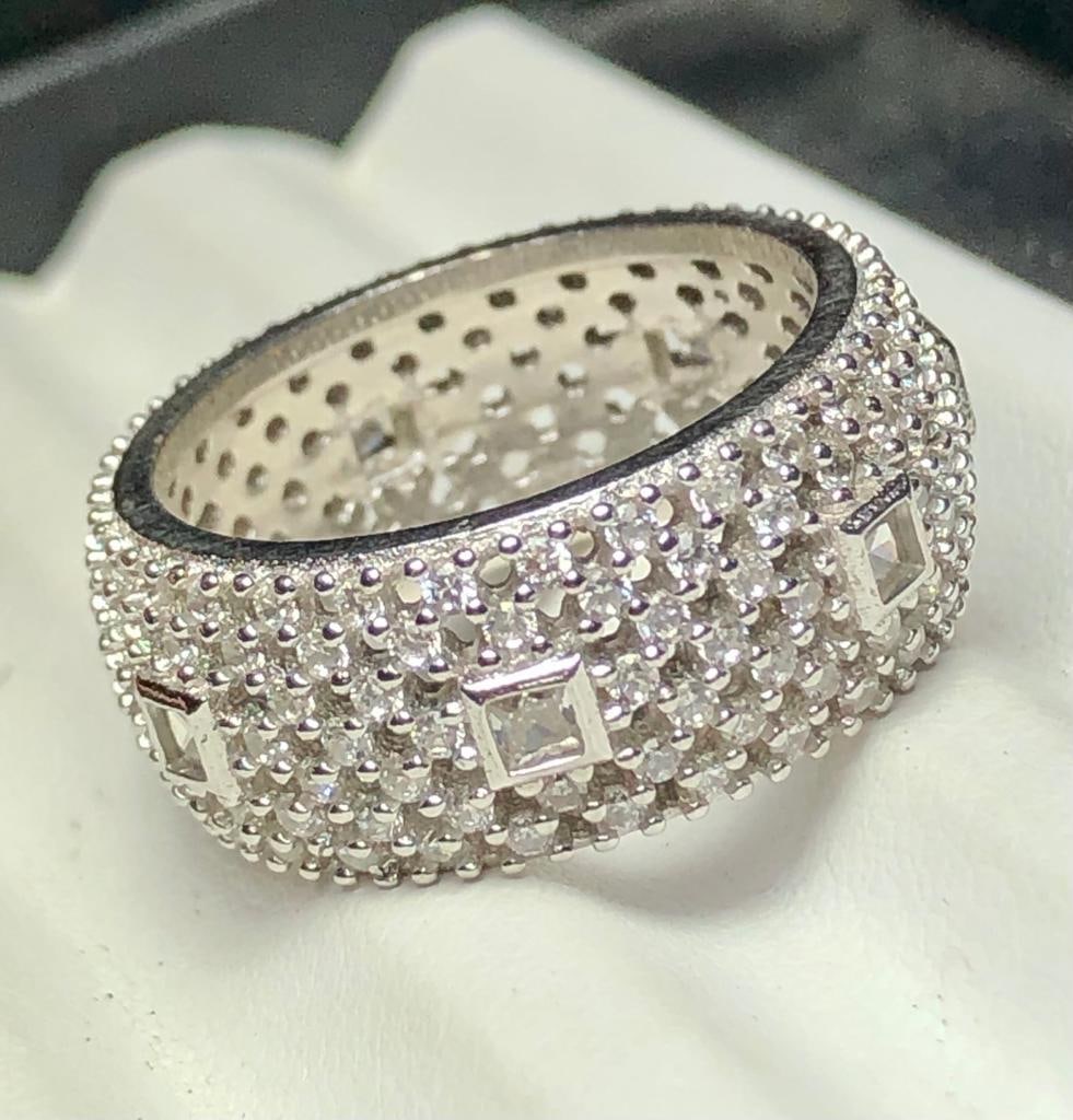 Sterling Silver Engagement Ring With White Zircons: Sterling Silver Engagement Ring With White ZirconsFREE SHIPPING Shipping rates are determined by Parcel weight and destination.