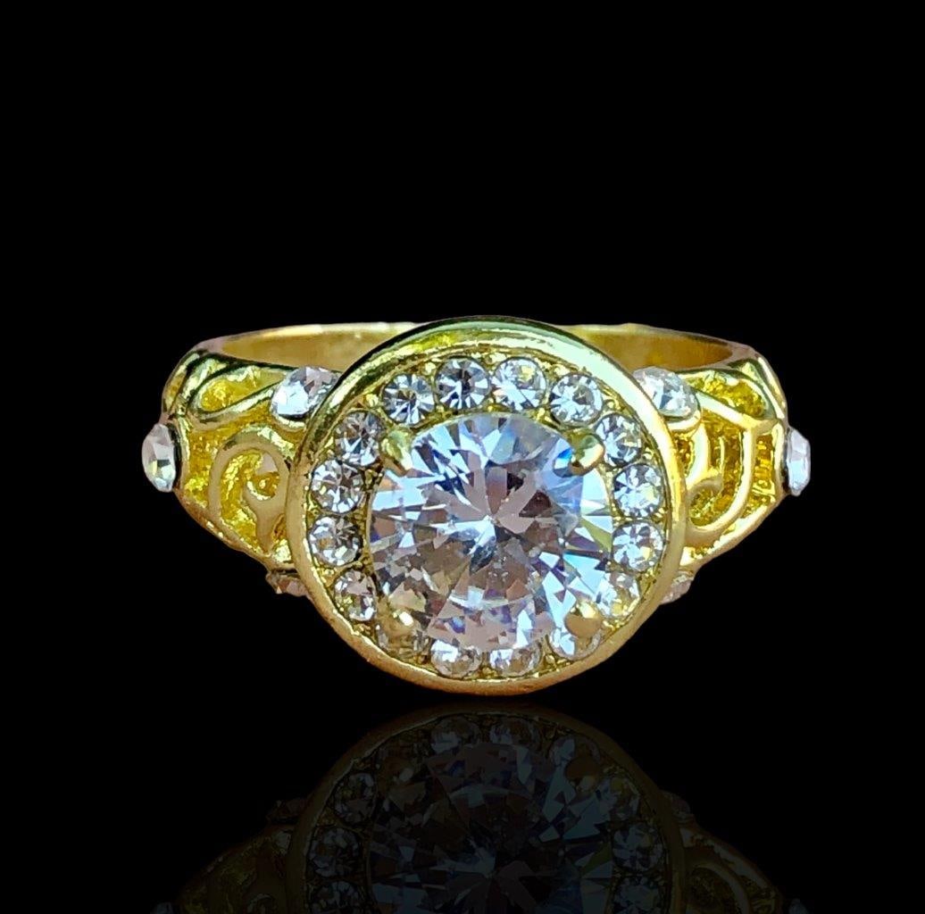 Gold Plated Copper Ring With White Zircon Stones: Gold Plated Copper Ring With White Zircon Stones FREE SHIPPING Shipping rates are determined by Parcel weight and destination.