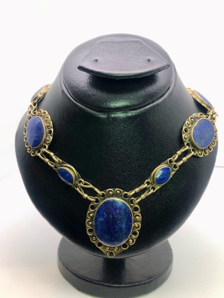Brass Jewelry Lapis Lazuli Necklace – Natural Blue Gemstone – Vintage Estate Jewelry: an elegant hand carved lapis lazuli necklace showcasing the rich royal blue coloration for which this gemstone is prized. The stone displays natural variations and may show subtle pyrite inclusions, a