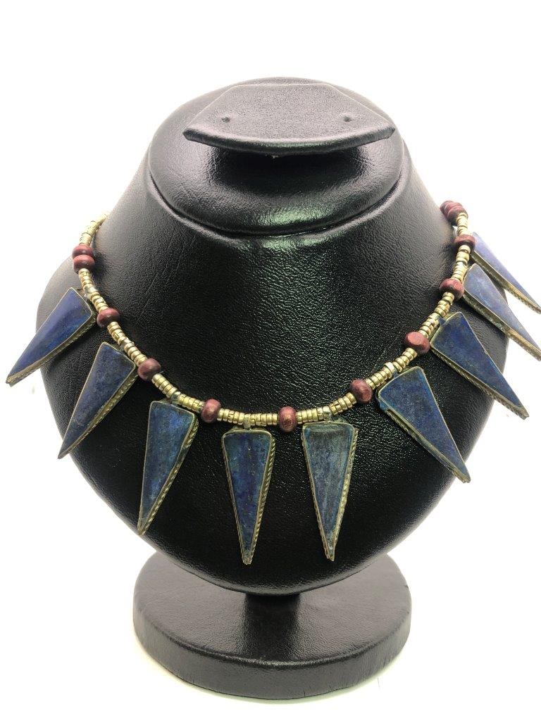 Vintage Hand Carved Lapis Lazuli Brass Necklace: an elegant hand carved lapis lazuli necklace showcasing the rich royal blue coloration for which this gemstone is prized. The stone displays natural variations and may show subtle pyrite inclusions, a