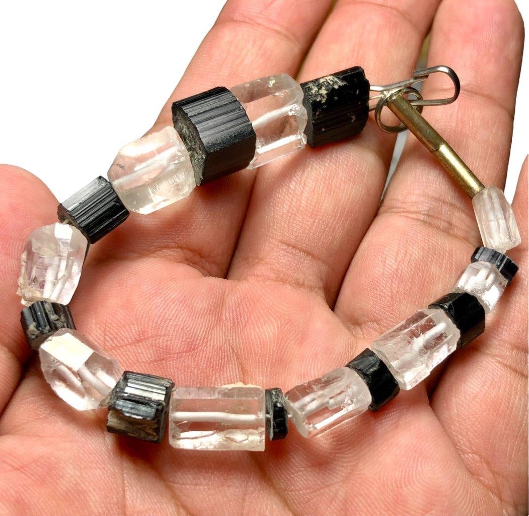Quartz With Black Tourmaline Love Bracelet: Quartz With Black Tourmaline Love Bracelet Shipping: $23.00. Shipping rates are determined by Parcel weight and destination.