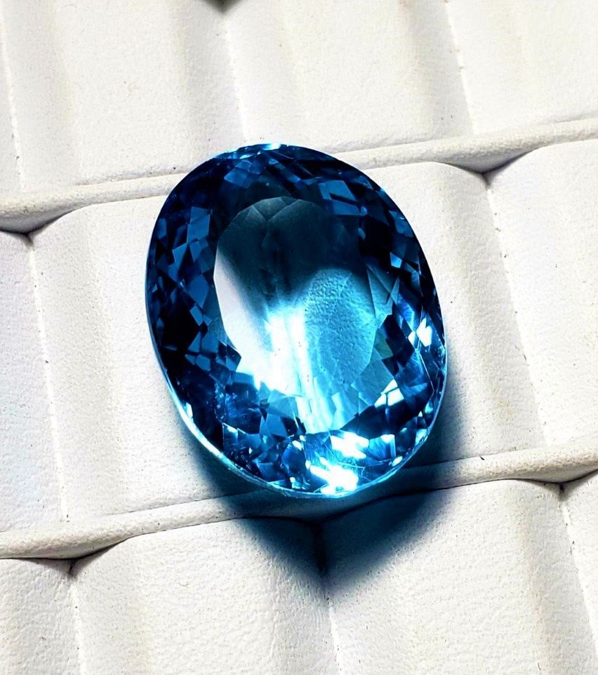Swiss Blue Topaz - 31 Carats: Swiss Blue Topaz - 31 Carats - 22X17X11 mmShipping Rate: $15.00 .shipping rates are determined by Parcel weight and destination.Combined shipping: We offer combine shipping on multiple items purchased