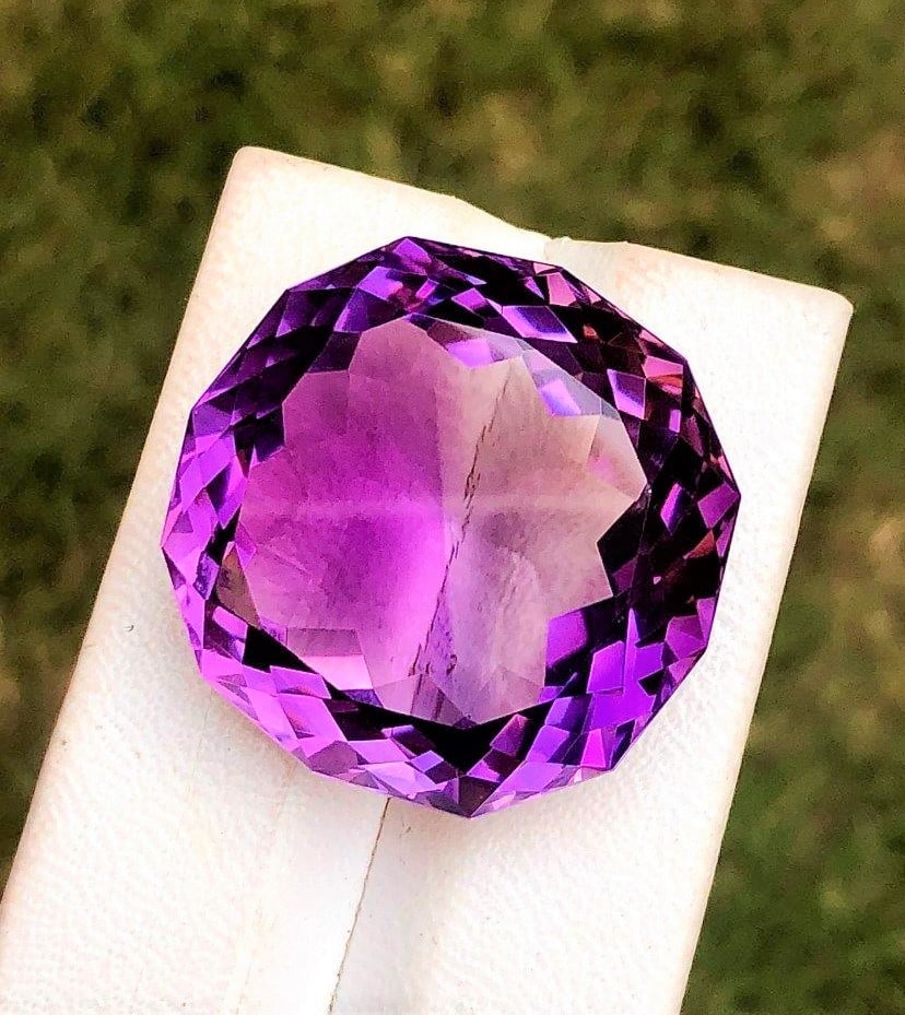 Pavilion Flower Natural Amethyst - 89.40 Carats: Pavilion Flower Perfect Cut Natural Amethyst - 89.40 Carats - 29X18 mmShipping Rate: $15.00 .shipping rates are determined by Parcel weight and destination.Combined shipping: We offer combine shipping