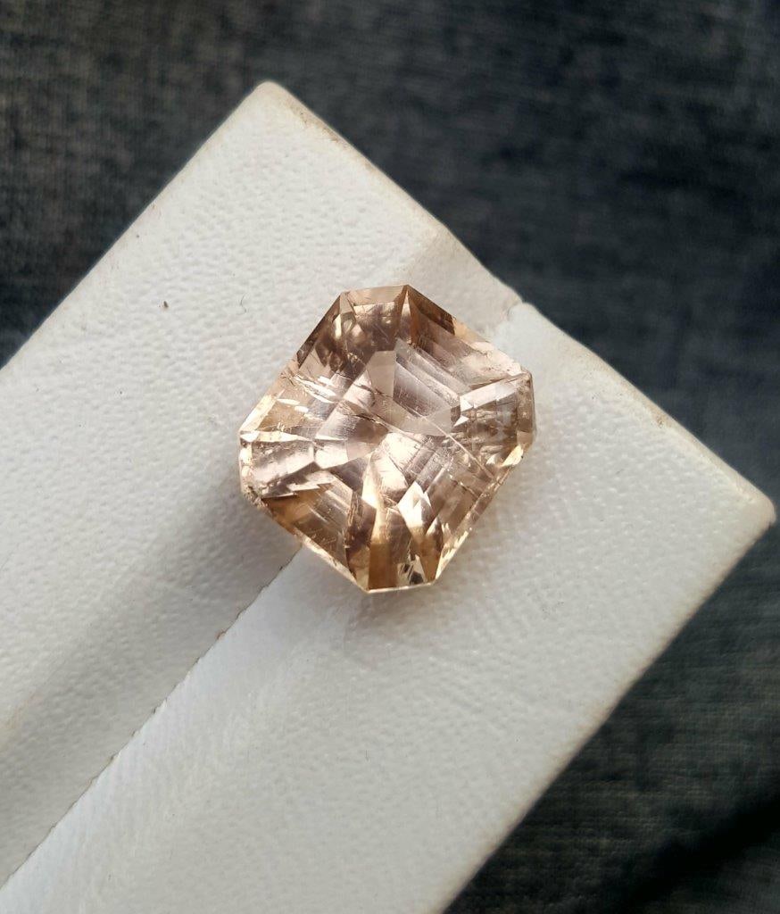 Asscher Cut Imperial Topaz - 13.90 Carats: Asscher Cut Imperial Topaz - 13.90 Carats - 14X13X10 mmShipping Rate: $15.00 .shipping rates are determined by Parcel weight and destination.Combined shipping: We offer combine shipping on multiple