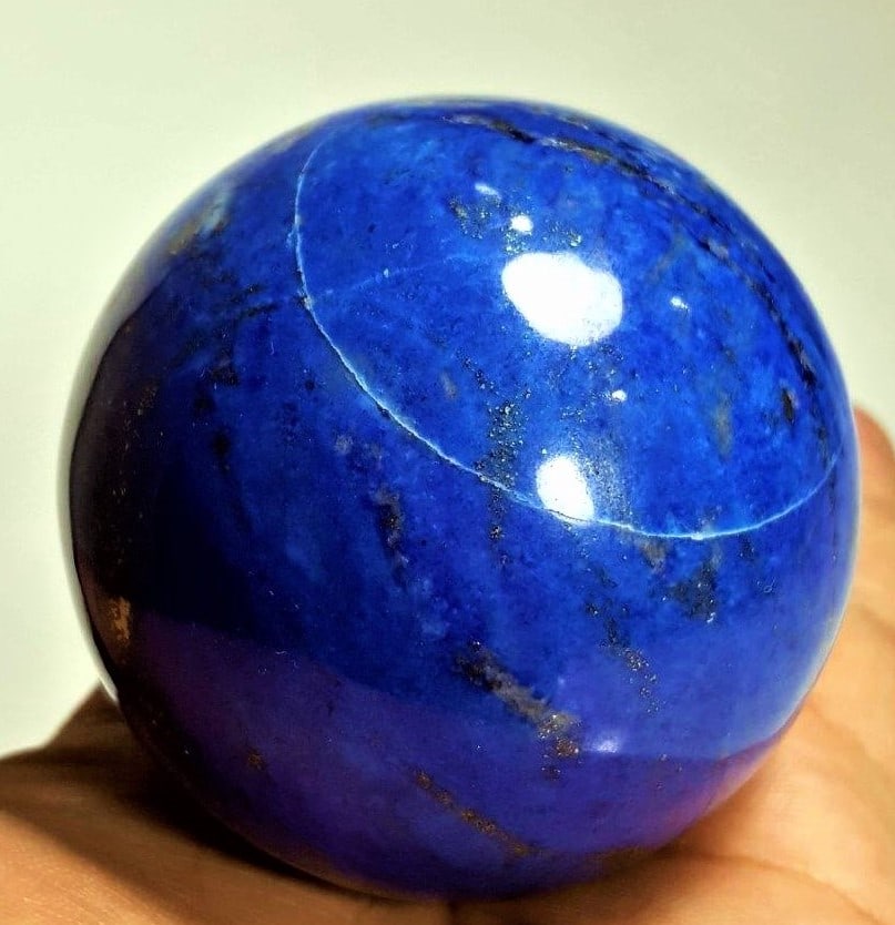 Pyrite Inclusion - Lapis Lauzli Sphere - 377 Grams: Pyrite Inclusion - Lapis Lauzli Sphere - 377 Grams - Diameter 62 mmShipping Rate: $45.00 .shipping rates are determined by Parcel weight and destination.Combined shipping: We offer combine shipping on