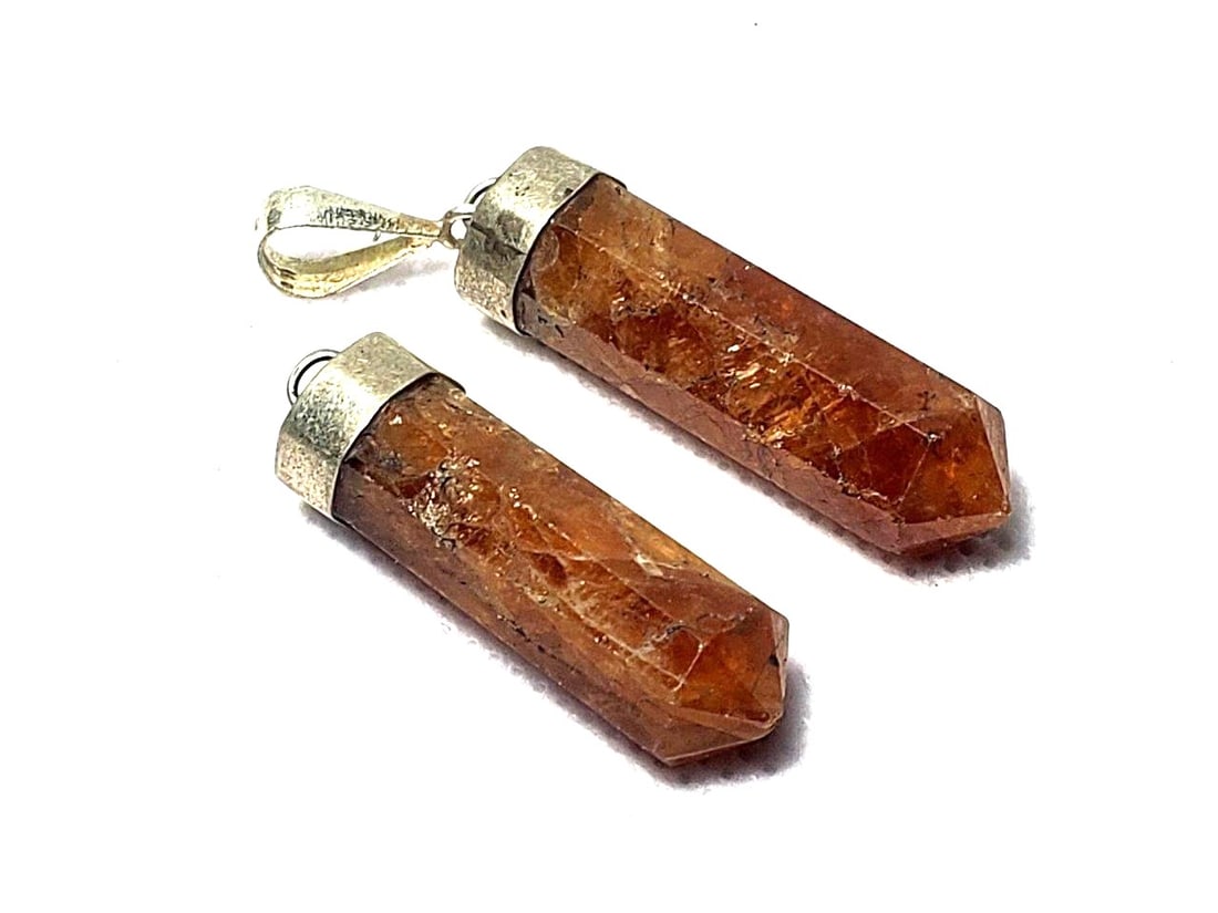 Sterling Silver Hessonite Garnet Pendants: Sterling Silver Hessonite Garnet Pendants Shipping: $23.00. Shipping rates are determined by Parcel weight and destination.