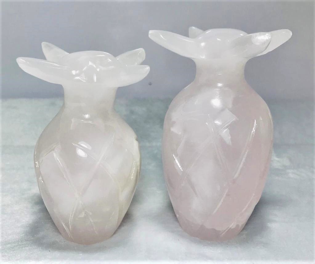 Pink Calcite pineapple pair 838.3G: Decorative calcite stone table decoration piece of pineapple pair in pinkish color 838.3G Shipping: $70.00. Shipping rates are determined by Parcel weight and destination.