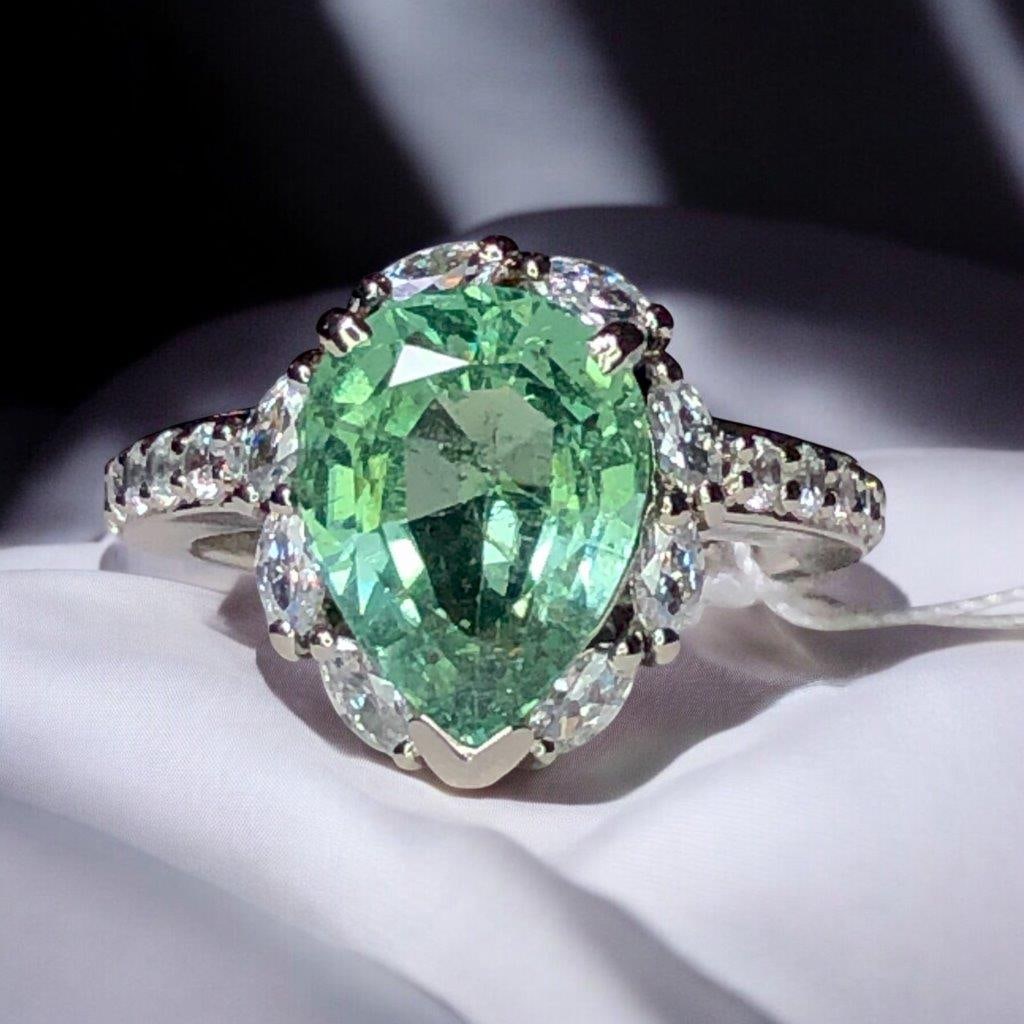 Natural Pear Shape Gree Tourmaline In Silver - Ring size - 7.5 US: Natural Pear Shape Gree Tourmaline In Silver - Ring size - 7.5 US Stone Weight: 4.70 CaratJewelry Weight: 5.65 GramsRing Size: 7.5 US(Adjustable) Choose design of your own and we will make it for youW