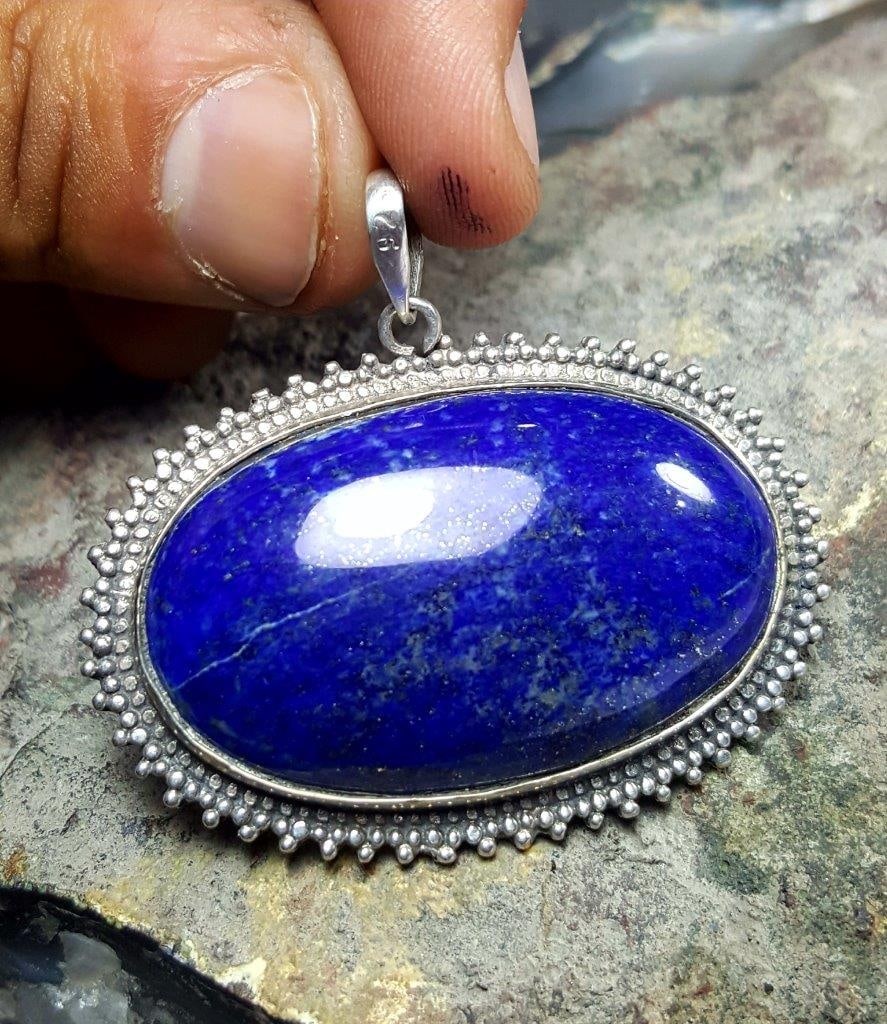 Blue gemstone Lapis pendant: Blue gemstone Lapis pendant - 35X47X9 mmShipping Rate: $23.00 .shipping rates are determined by Parcel weight and destination.Combined shipping: We offer combine shipping on multiple items purchased t