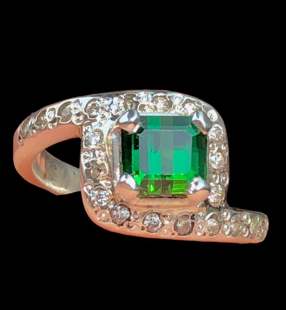 Green Tourmaline Ring With Zircons In Silver: Green Tourmaline Ring With Zircons In SilverStone Weight: 2.75 CaratsRing Size: 9 US(Adjustable)Ring Weight: 6.52 GramsMetal: Silver Choose design of your own and we will make it for youWe accept cust