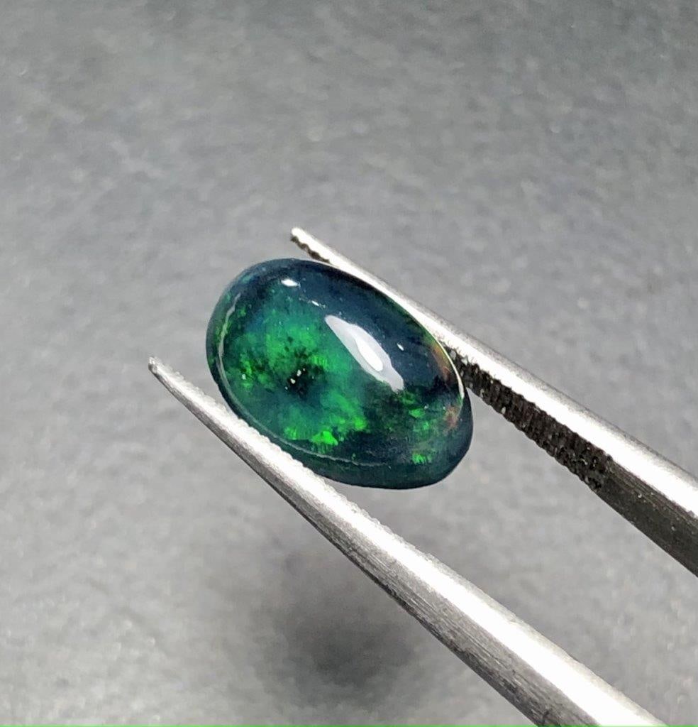 1.40 Carats Natural Black Opal - 11X8X5 mm: 1.40 Carats Natural Black Opal - 11X8X5 mm Shipping: