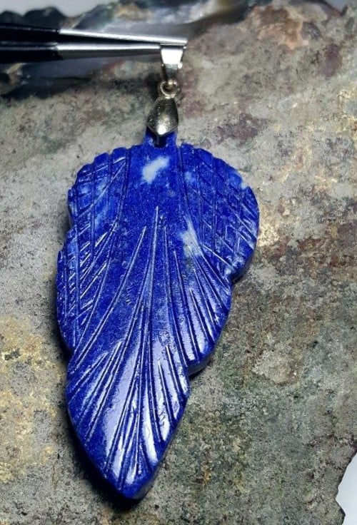 Leaf pendant with a lapis lazuli gemstone: Leaf pendant with a lapis lazuli gemstone - 58X27X5 mm Shipping: $23.00. Shipping rates are determined by Parcel weight and destination.