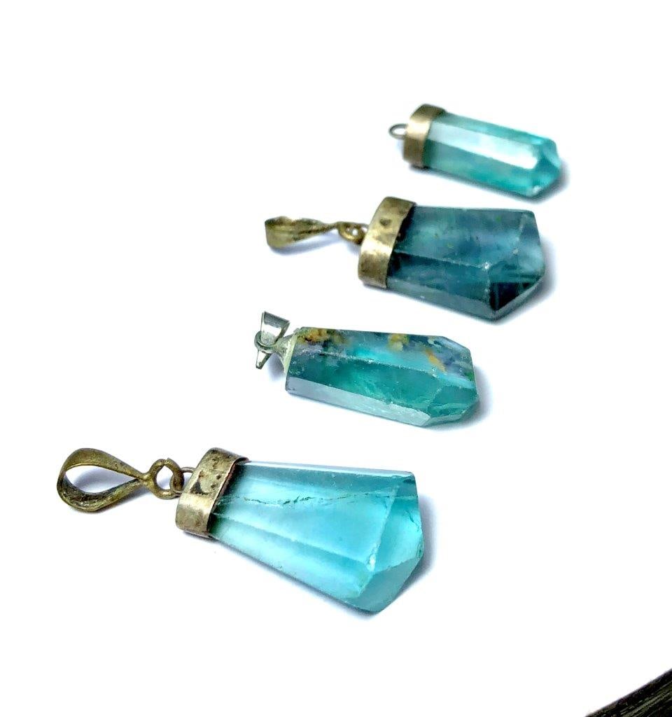 Fluorite Crystal Point Pendants Natural Gemstone Jewelry: Fluorite Crystal Point Pendants Natural Gemstone Jewelry Shipping: $23.00. Shipping rates are determined by Parcel weight and destination.