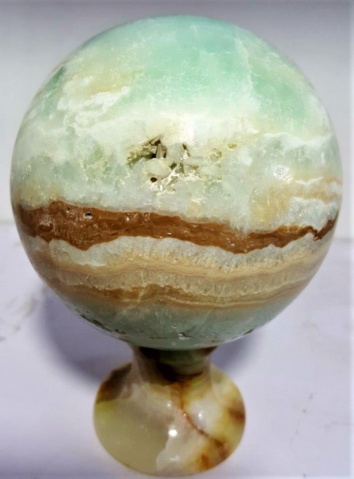 990 Grams Carrabian Calcite Sphere: 990 Grams Carrabian Calcite SphereShipping Rate: $75.00 .shipping rates are determined by Parcel weight and destination.Combined shipping: We offer combine shipping on multiple items purchased to redu