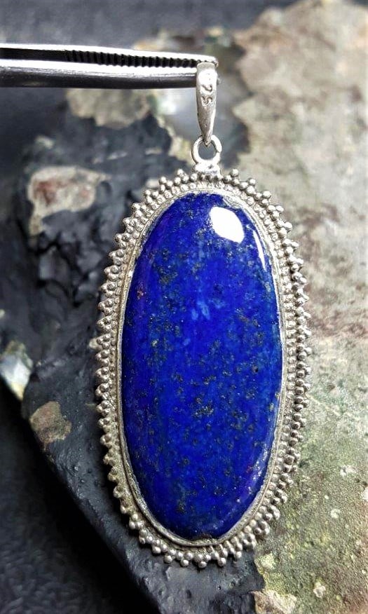 Vintage Natural Lapis Lazuli Stone pendant: Vintage Natural Lapis Lazuli Stone pendant - 57X28X5 mmShipping Rate: $23.00 .shipping rates are determined by Parcel weight and destination.Combined shipping: We offer combine shipping on multiple
