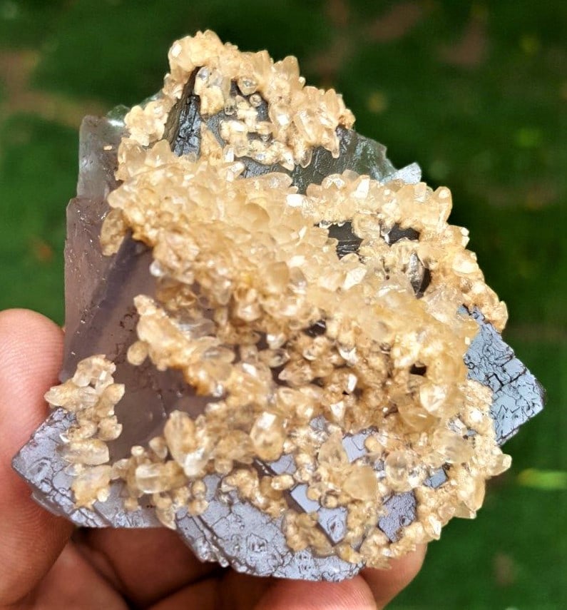 Fluorite Crystal With Calcite Cluster - 115 Grams: Fluorite Crystal With Calcite Cluster - 115 Grams - 59X54X35 mmShipping Rate: $23.00 .shipping rates are determined by Parcel weight and destination.Combined shipping: We offer combine shipping on mul