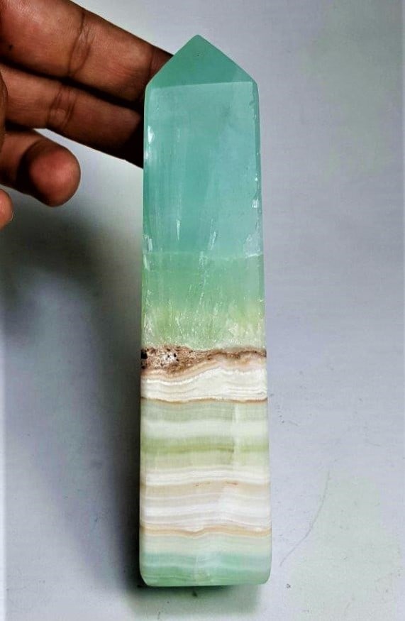 Pistachio Calcite Point Tower - 420 Grams: Pistachio Calcite Point Tower - 420 GramsShipping Rate: $45.00 .shipping rates are determined by Parcel weight and destination.Combined shipping: We offer combine shipping on multiple items purchased