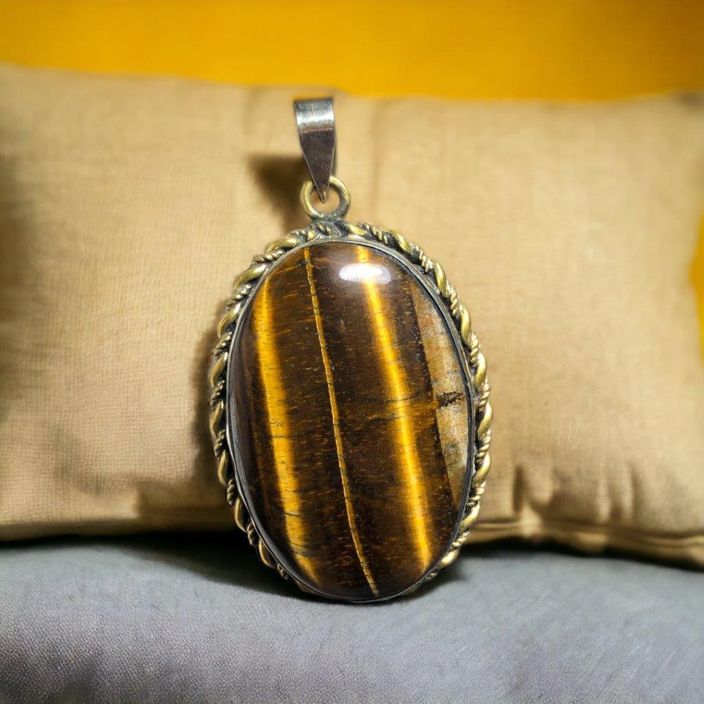 Tiger's eye crystal Pendant: 4.35 Carats Natural Aquamarine Cab - 11X9X6 mm Shipping: