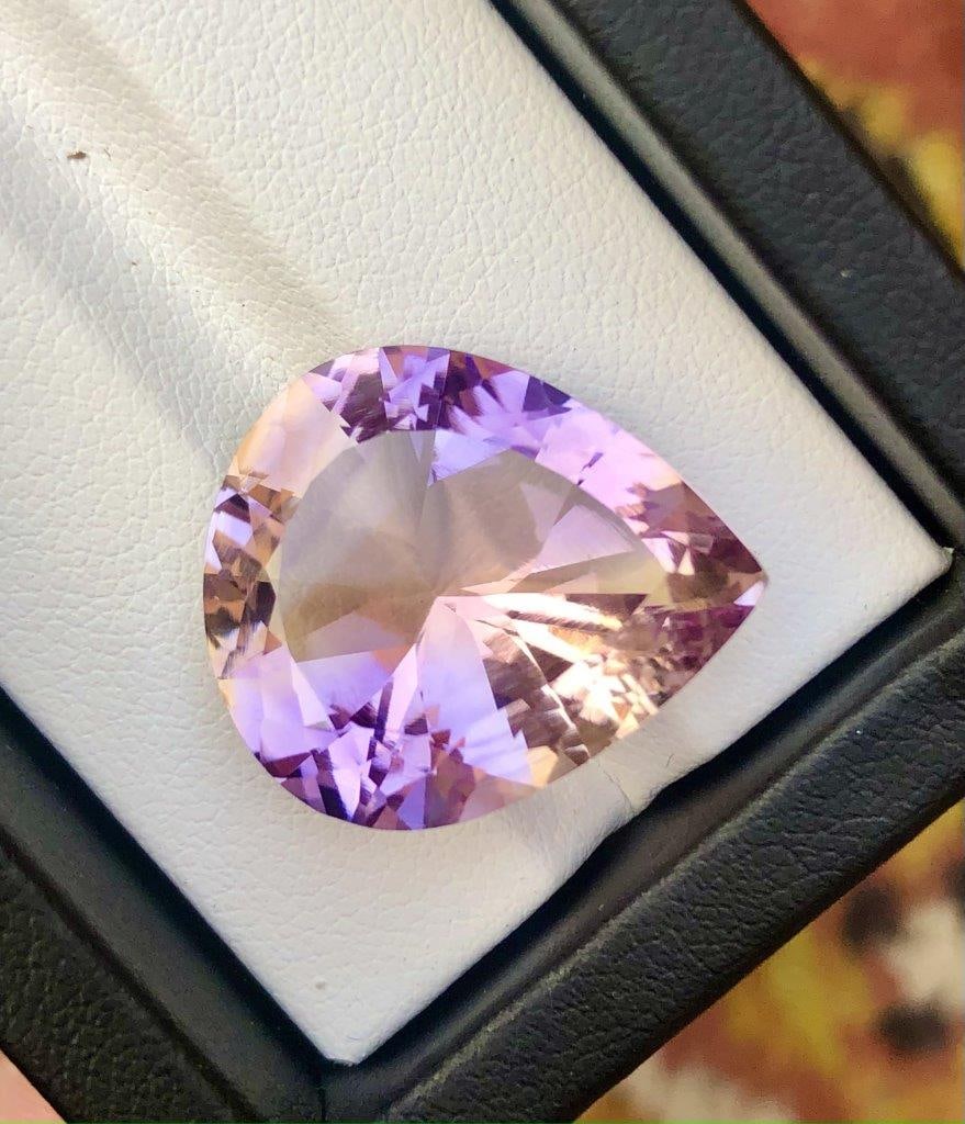 Multi Color Natural Pear Shape Ametrine - 20.90 Carats - 22X18X11 mm: Multi Color Natural Pear Shape Ametrine - 20.90 Carats - 22X18X11 mmShipping Rate: $15.00 .shipping rates are determined by Parcel weight and destination.Combined shipping: We offer combine shipping o