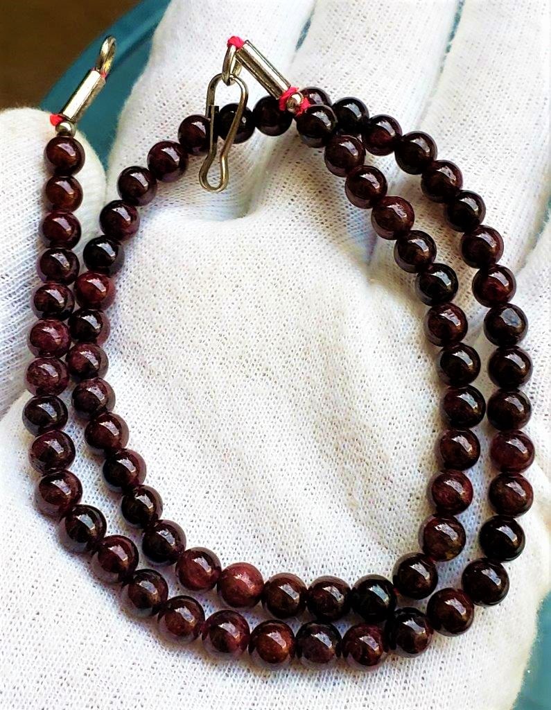 Dark Brown Beautiful Garnet beaded necklace: Dark Brown Beautiful Garnet beaded necklace measures 6 mm Bead Size - Length 40 Cm Shipping: $23.00. Shipping rates are determined by Parcel weight and destination.