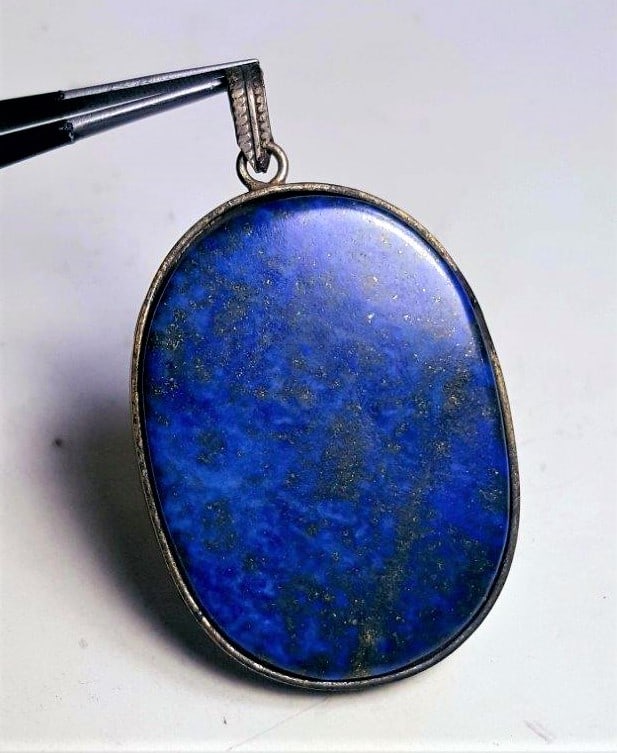 Royal Blue Lapis Pendant: Royal Blue Lapis Pendant - 53X36X7 mm Shipping: $23.00. Shipping rates are determined by Parcel weight and destination.