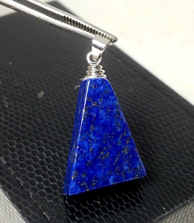 Sterling Silver Lapis Lazuli With Pyrite Pendant: Sterling Silver Lapis Lazuli With Pyrite Pendant - 37X21X7 mm Shipping: $23.00. Shipping rates are determined by Parcel weight and destination.