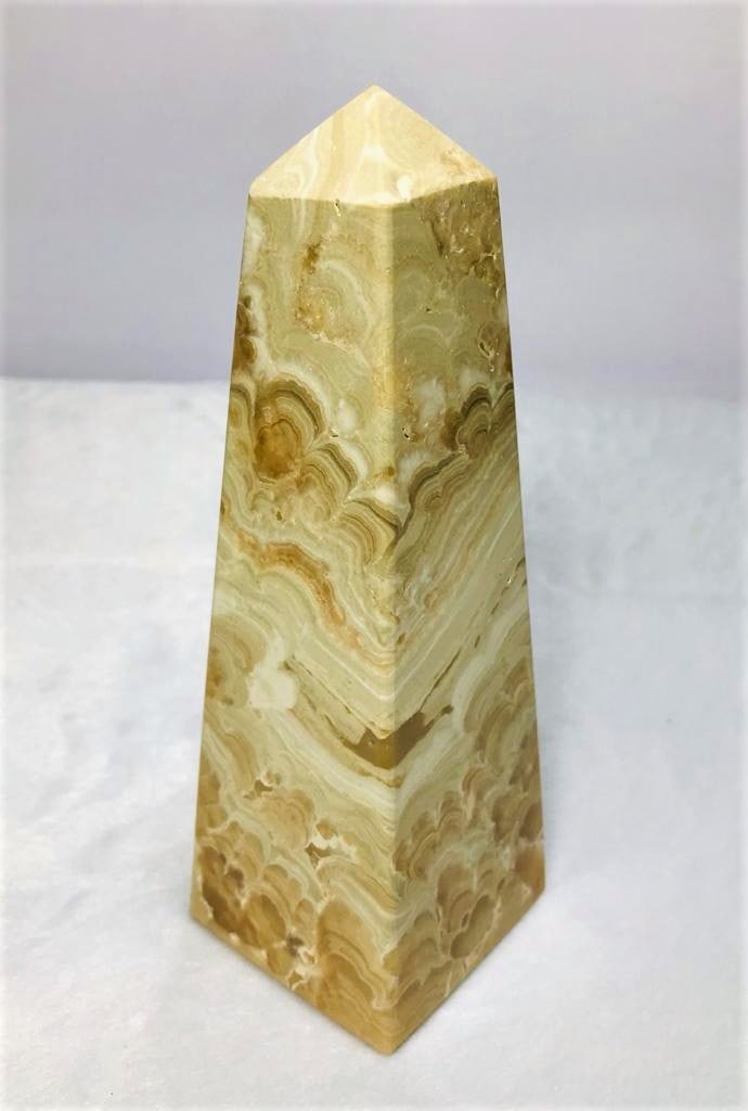 Choclate Calcite point tower - 631.2G: Choclate Calcite point tower - 155X51mm - 631.2G Shipping: $55.00. Shipping rates are determined by Parcel weight and destination.
