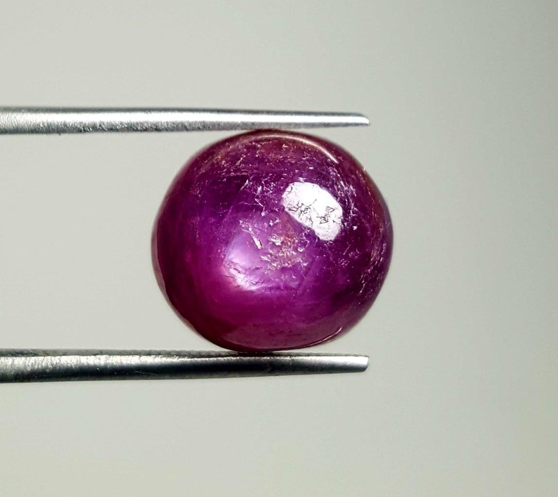 Natural Ruby Cats Eye Cab - 12 Carats: Natural Ruby Cats Eye Cab - 12 Carats - 12.5X12X8 mmShipping Rate: $15.00 .shipping rates are determined by Parcel weight and destination.Combined shipping: We offer combine shipping on multiple items