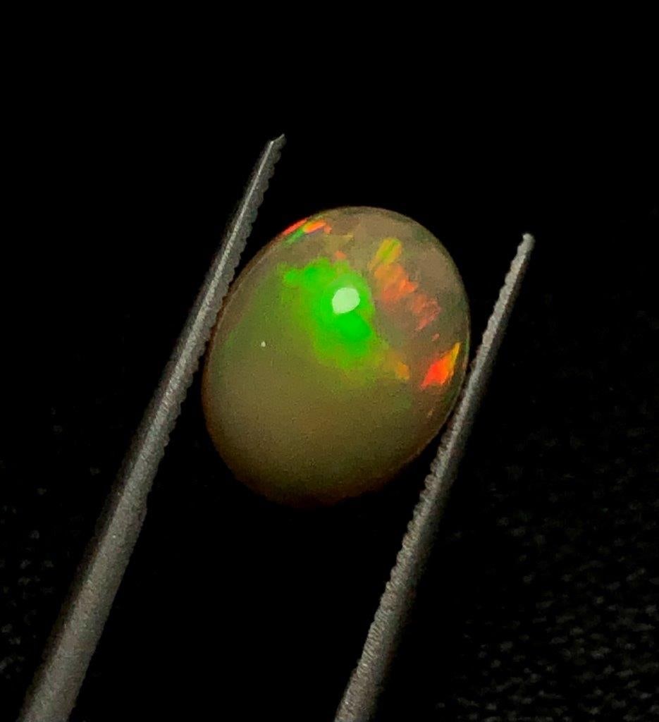 1.60 Carats Ethopian Opal - 10X9X5 mm: 1.60 Carats Ethopian Opal - 10X9X5 mmShipping Rate: $15.00 .shipping rates are determined by Parcel weight and destination.Combined shipping: We offer combine shipping on multiple items purchased to r