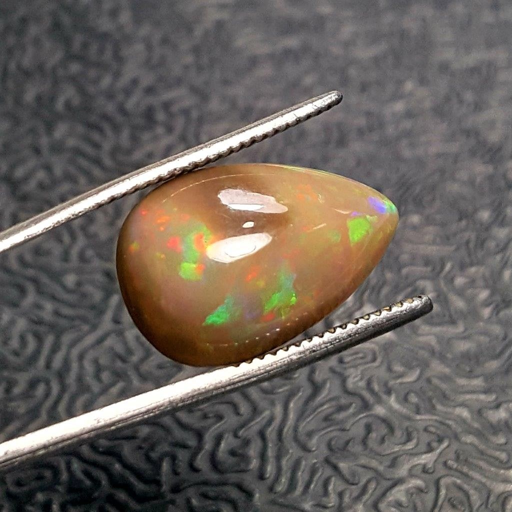 Pear Shape Fire Opal - 7.15 Carats: Pear Shape Fire Opal - 7.15 CaratsShipping Rate: $15.00 .shipping rates are determined by Parcel weight and destination.Combined shipping: We offer combine shipping on multiple items purchased to redu