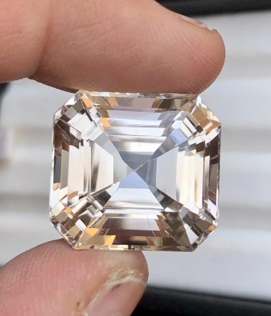 46.25 Carats Natural Asscher Cut Golden Topaz Gemtone - 19X20X14 mm: 46.25 Carats Natural Asscher Cut Golden Topaz Gemtone - 19X20X14 mm Choose design of your own and we will make it for youWe accept custom order in Sterling Silver, Gold and Platinum in WholeSale Price