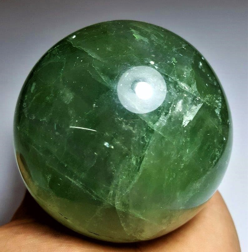 Amazing Fluorite Sphere - 1089 Grams: Amazing Fluorite Sphere - 1089 Grams - Diameter 86 mmShipping Rate: $75.00 .shipping rates are determined by Parcel weight and destination.Combined shipping: We offer combine shipping on multiple item