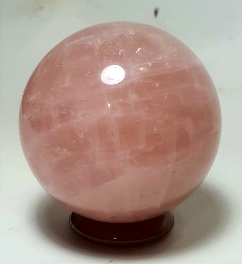 Polished Rose Quartz Sphere - 633 Grams: Polished Rose Quartz Sphere - 633 Grams - Diameter 77 mmShipping Rate: $55.00 .shipping rates are determined by Parcel weight and destination.Combined shipping: We offer combine shipping on multiple i